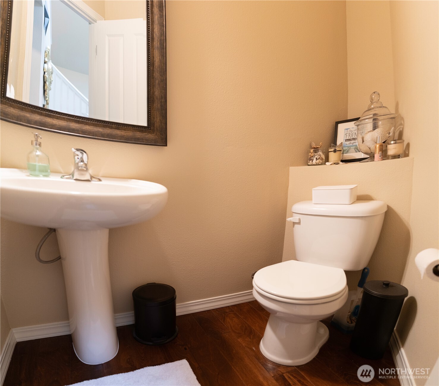 27661 McIntosh Loop Northeast Kingston, WA 98346 - Photo 14 of 34 a bathroom with a toilet sink and mirror