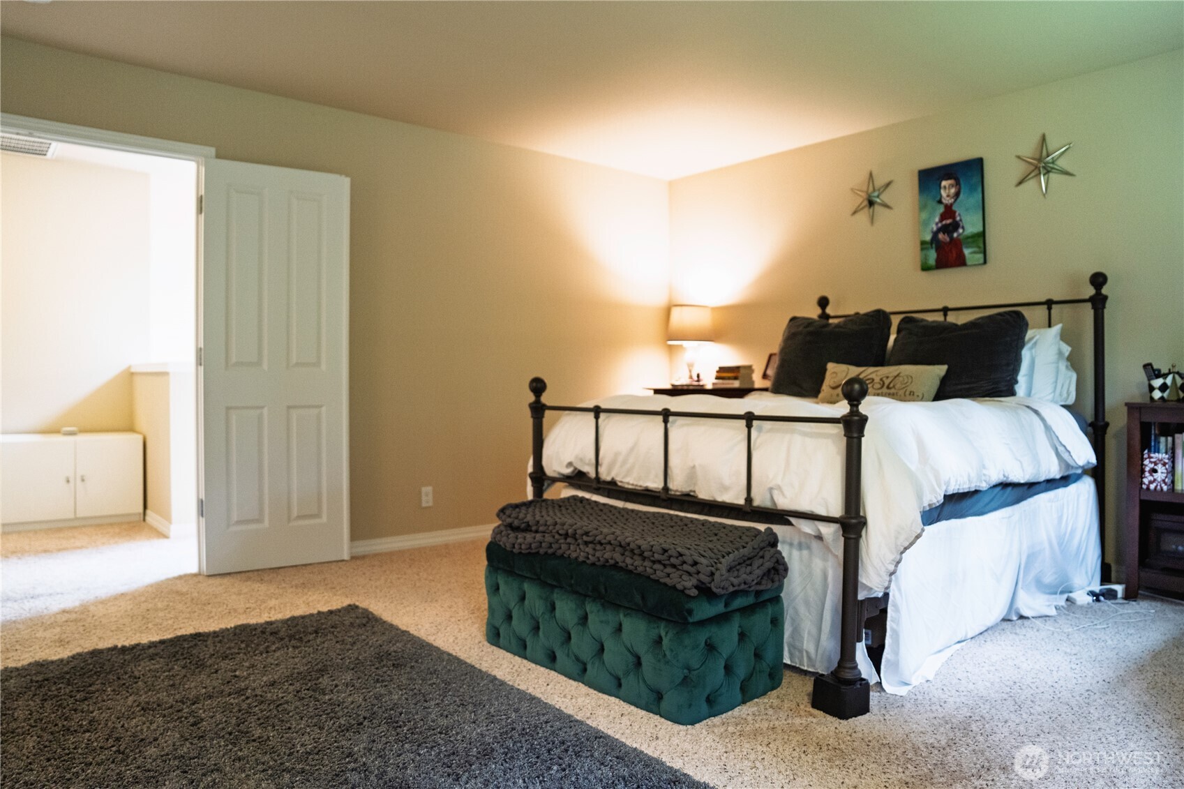 27661 McIntosh Loop Northeast Kingston, WA 98346 - Photo 16 of 34 a bedroom with bed and a night stand