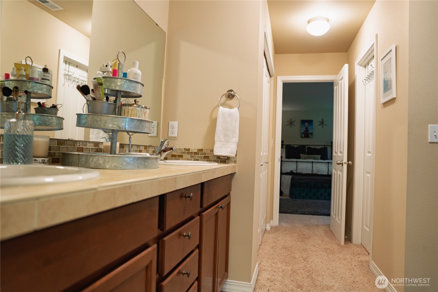 27661 McIntosh Loop Northeast Kingston, WA 98346 - Photo 17 of 34 a bathroom with a sink and a mirror