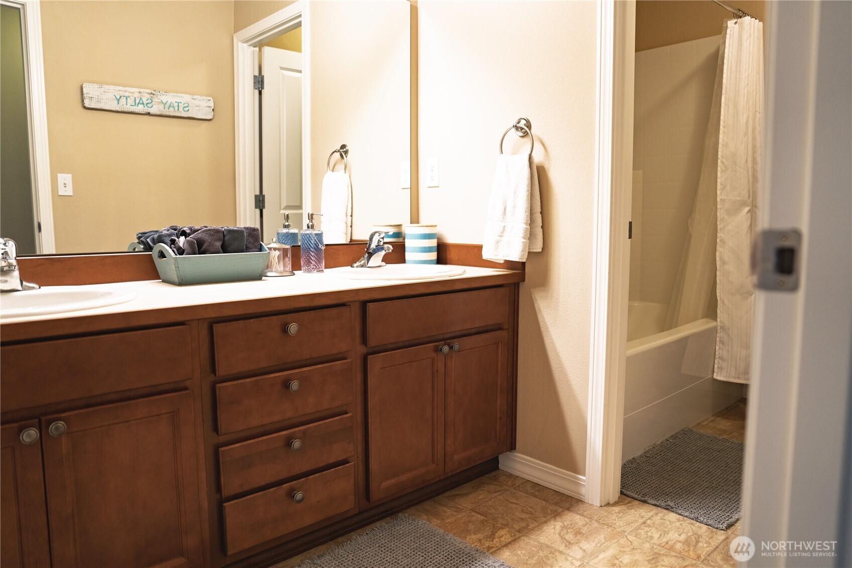 27661 McIntosh Loop Northeast Kingston, WA 98346 - Photo 23 of 34 a room with a sink and a mirror