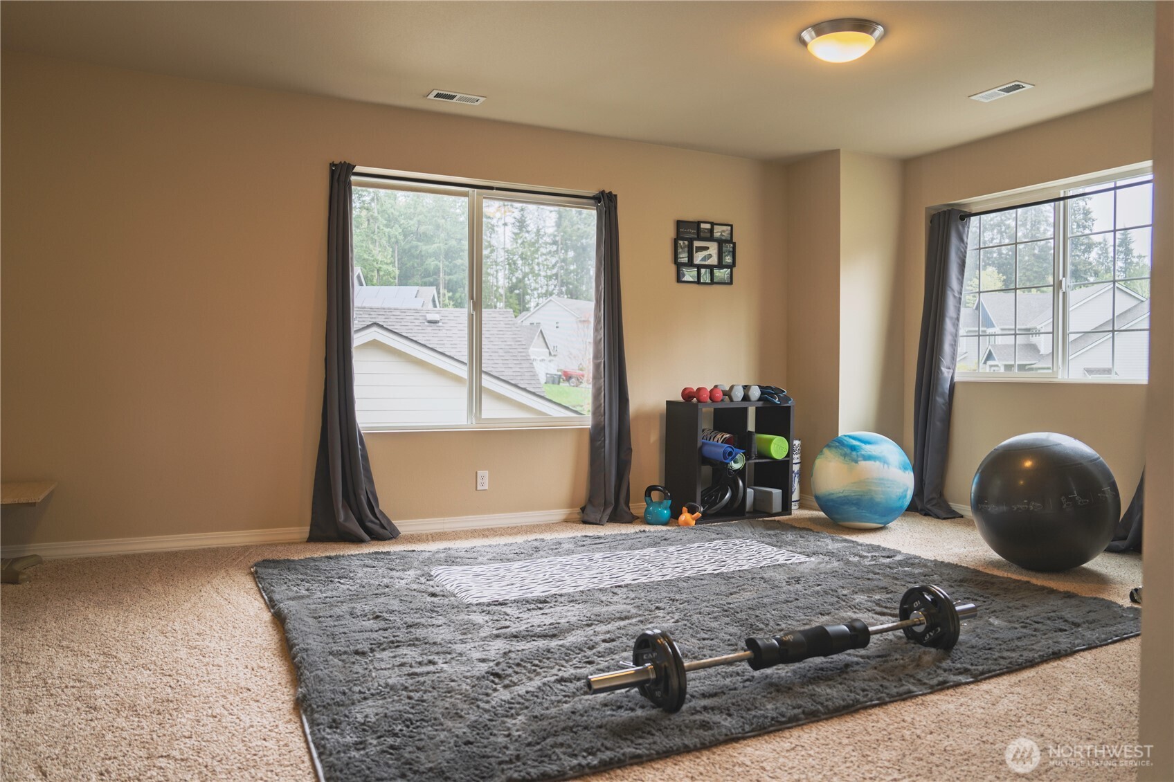 27661 McIntosh Loop Northeast Kingston, WA 98346 - Photo 27 of 34 a bedroom with a bed and a large window