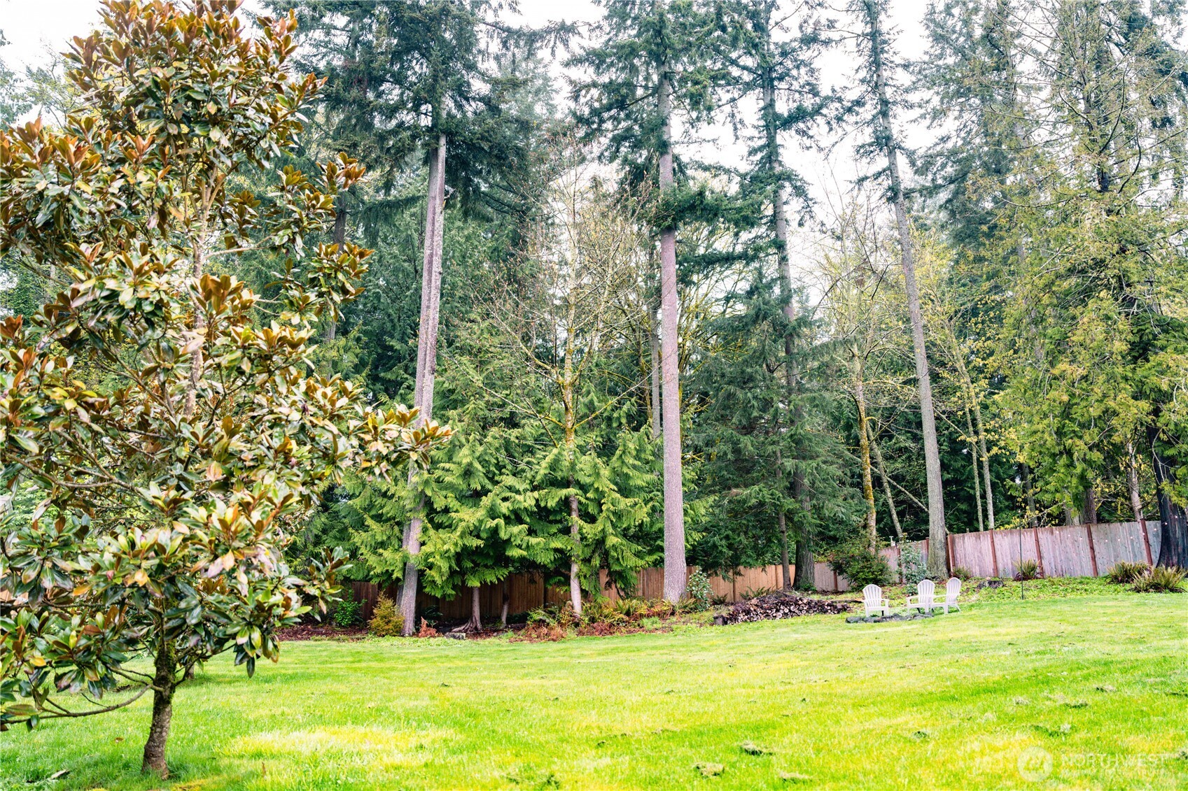 27661 McIntosh Loop Northeast Kingston, WA 98346 - Photo 32 of 34 a view of a playground with a tree