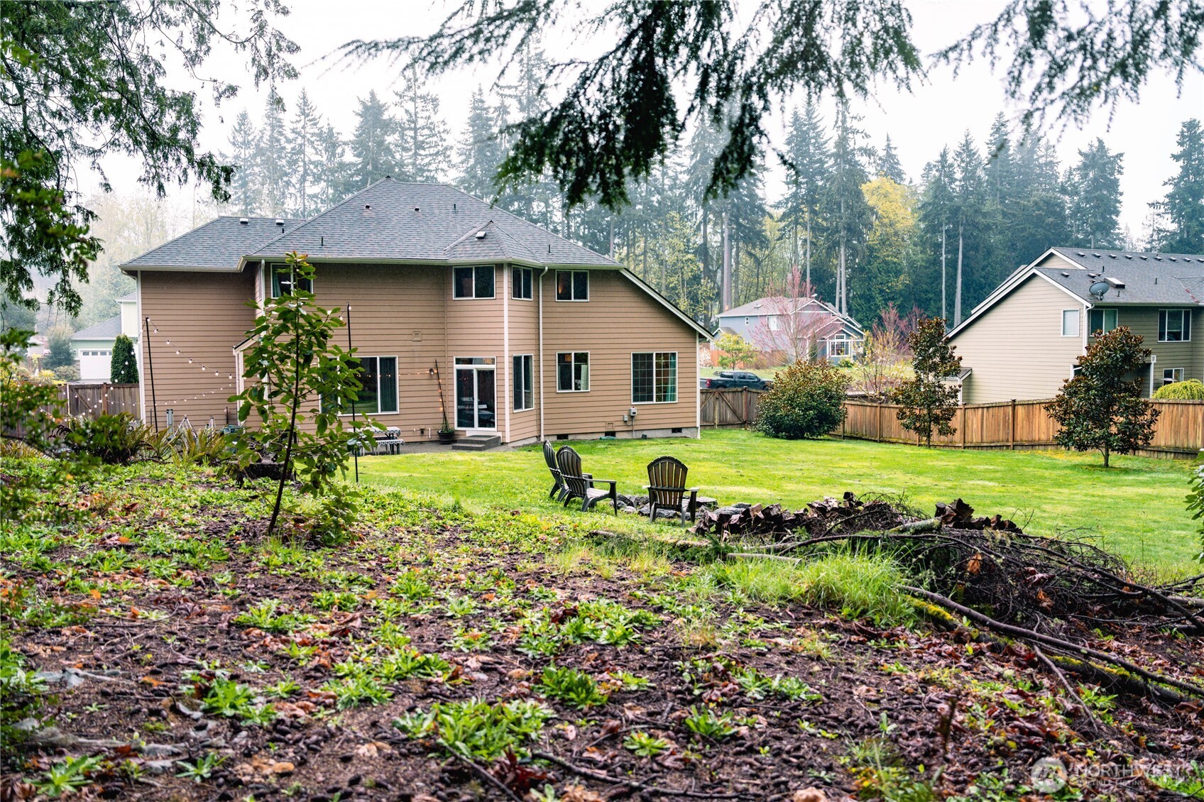 27661 McIntosh Loop Northeast Kingston, WA 98346 - Photo 33 of 34 a view of house with a yard and potted plants