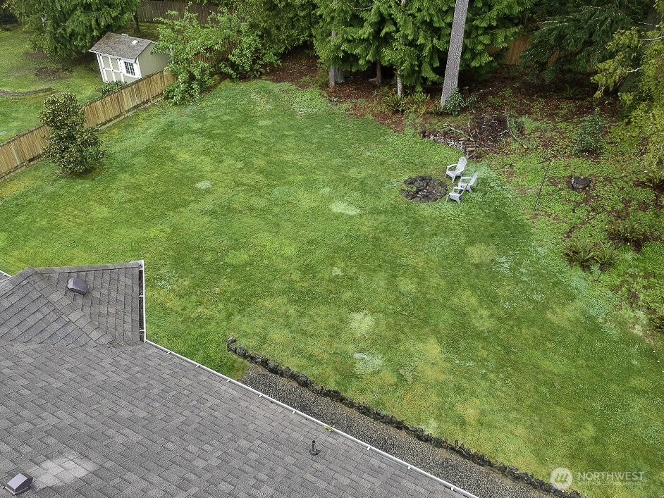 27661 McIntosh Loop Northeast Kingston, WA 98346 - Photo 34 of 34 a backyard of a house with lots of green space