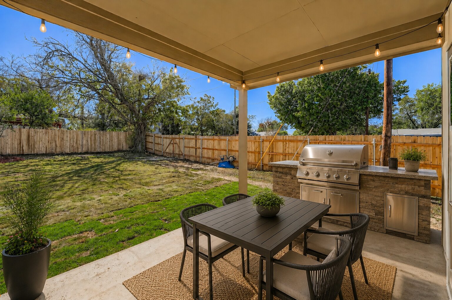 701 East 3rd Street Elgin, TX 78621 - Photo 30 of 35 Virtually staged covered patio area