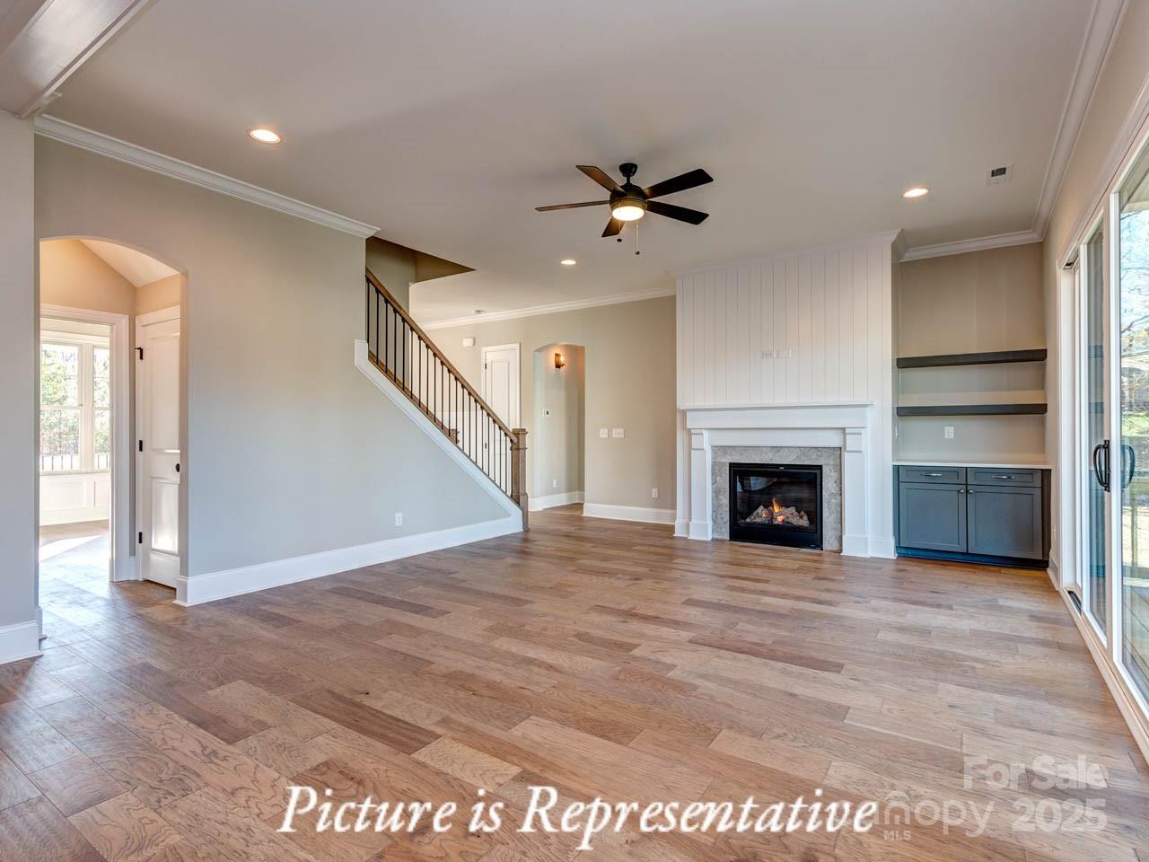 4238 Brushy Knoll York, SC 29745 - Photo 12 of 46 a view of an empty room with a fireplace and a window