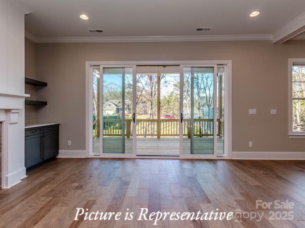 4238 Brushy Knoll York, SC 29745 - Photo 14 of 46 a view of an empty room with wooden floor and a window