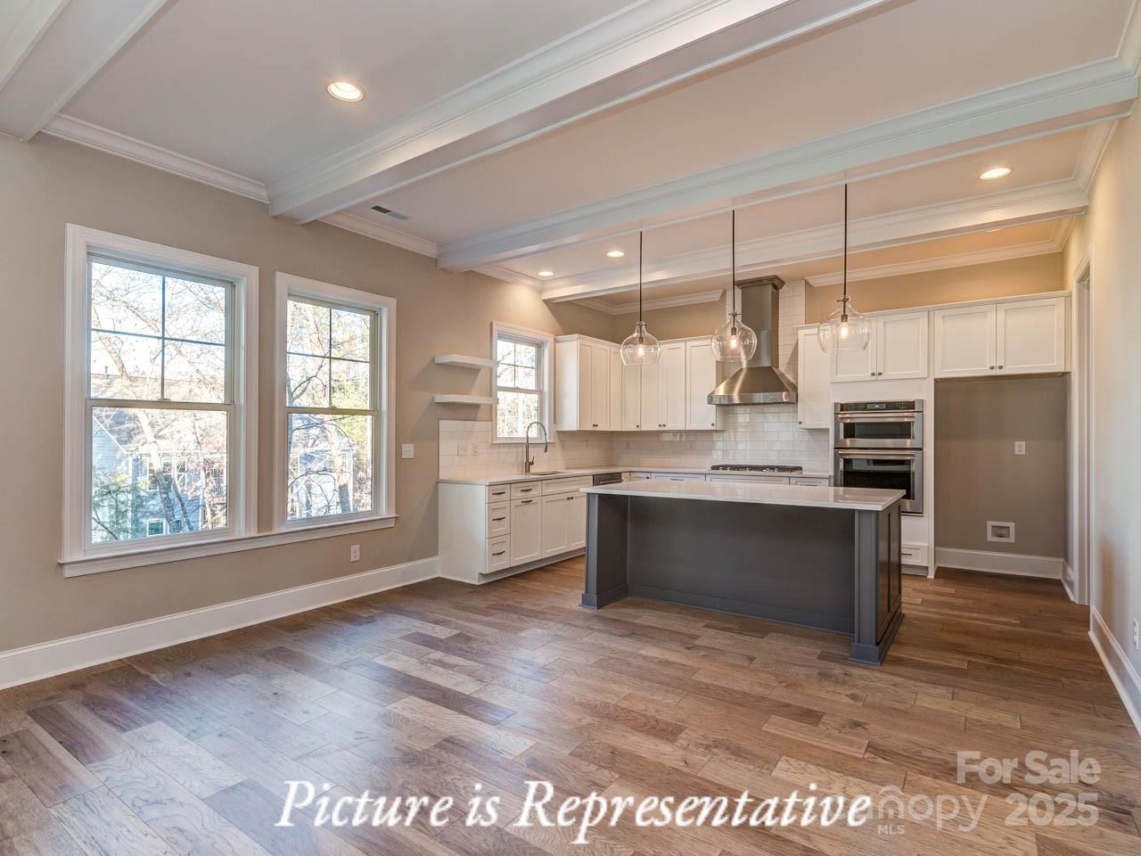 4238 Brushy Knoll York, SC 29745 - Photo 16 of 46 a large kitchen with kitchen island a sink stainless steel appliances and cabinets