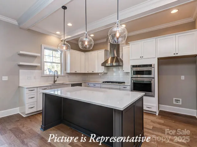 a kitchen with a stove and a refrigerator
