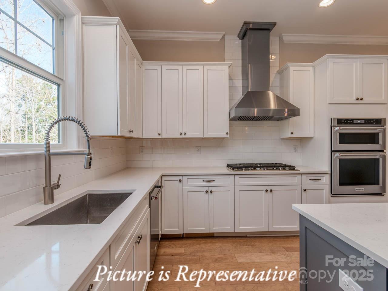 4238 Brushy Knoll York, SC 29745 - Photo 19 of 46 a kitchen with stainless steel appliances a sink a stove and a refrigerator