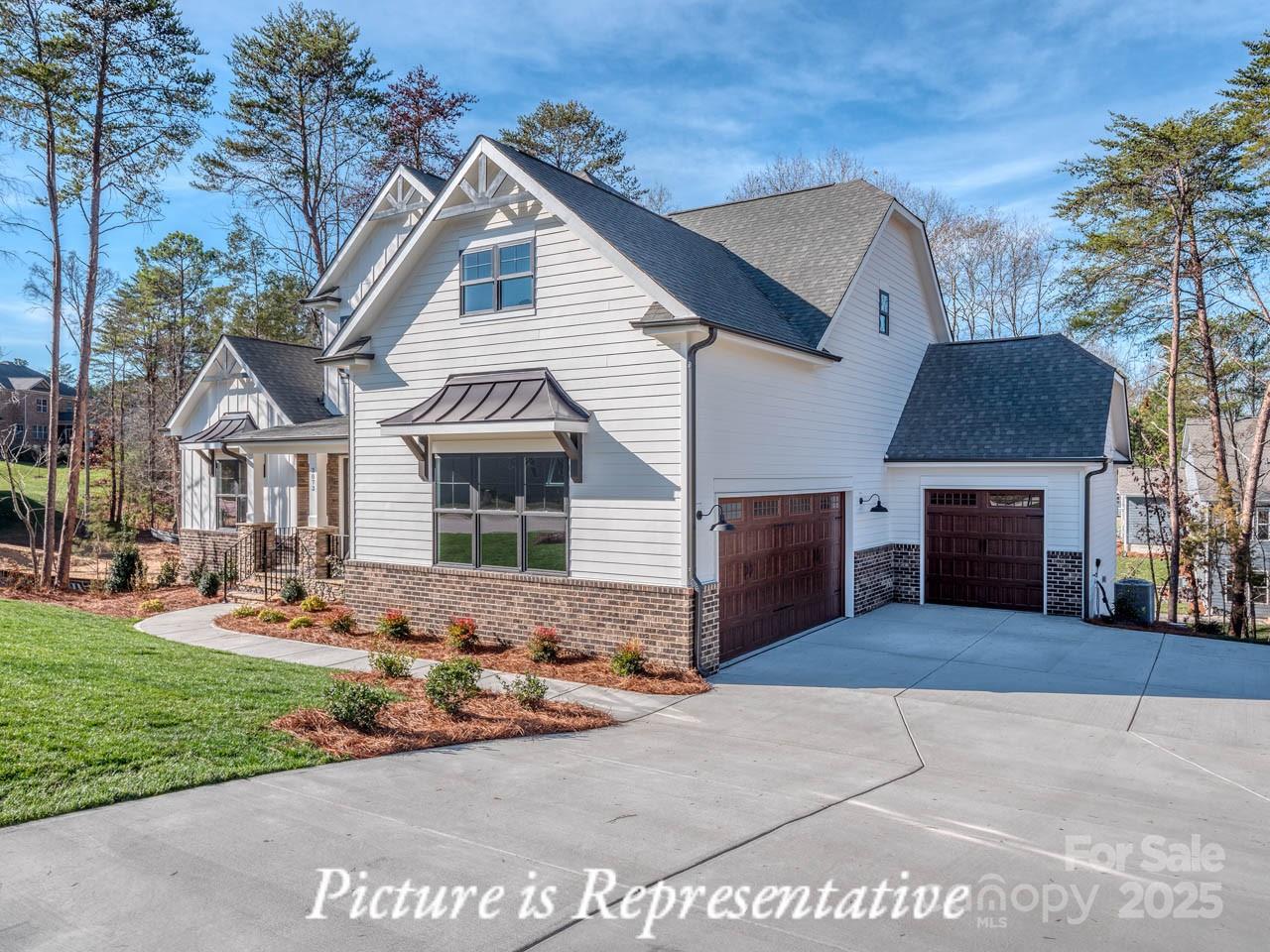 4238 Brushy Knoll York, SC 29745 - Photo 3 of 46 a front view of a house with a yard and garage