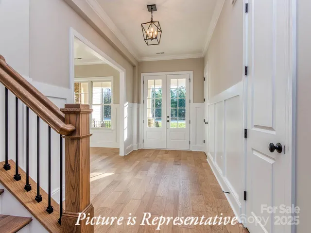 a view of an entryway with wooden floor