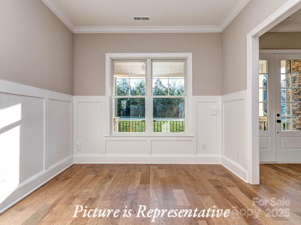 4238 Brushy Knoll York, SC 29745 - Photo 7 of 46 an empty room with wooden floor and windows