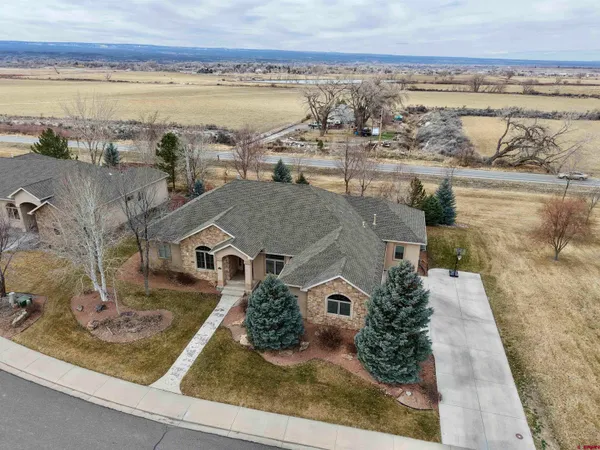 an aerial view of residential houses with outdoor space