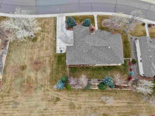 a aerial view of a house with a yard