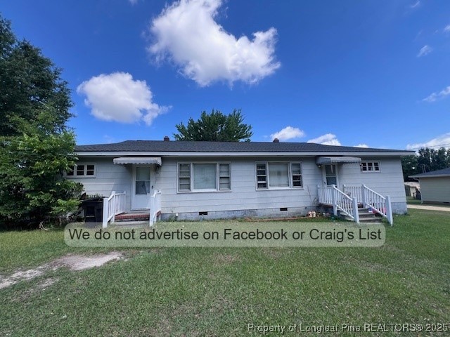 99 Susan Street Clinton, NC 28328 - Photo 1 of 10 a front view of a house with a garden