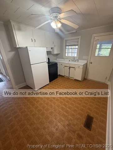 a view of a livingroom with furniture and windows