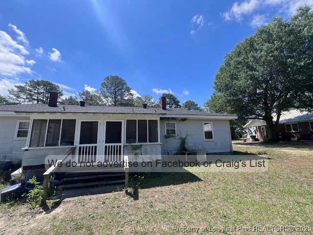 99 Susan Street Clinton, NC 28328 - Photo 10 of 10 a front view of a house with a garden and yard