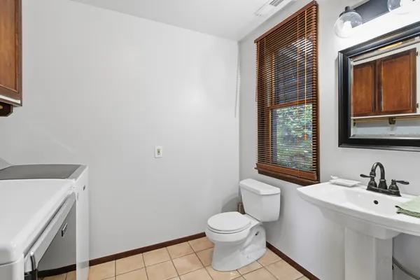 a bathroom with a glass shower door and a shower