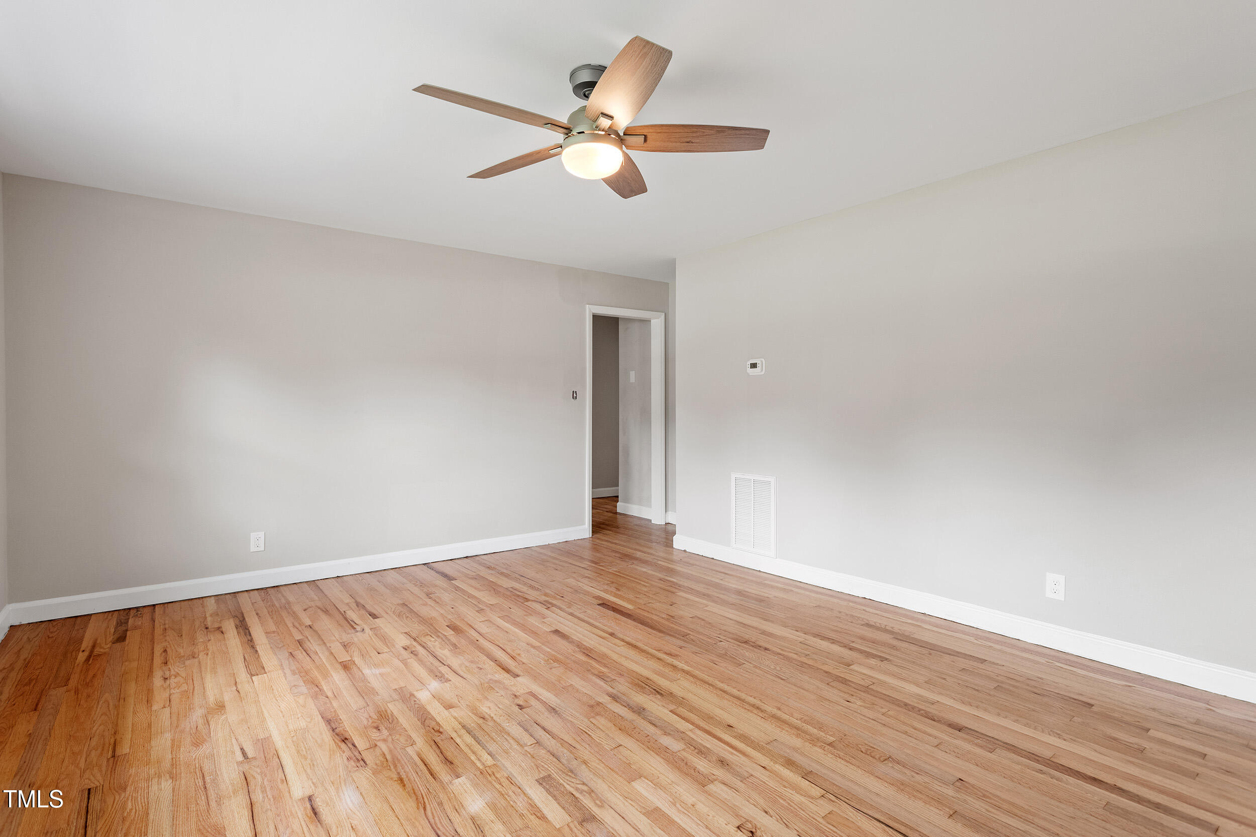 3325 Old Buffalo Road Raleigh, NC 27604 - Photo 3 of 26 wooden floor in an empty room
