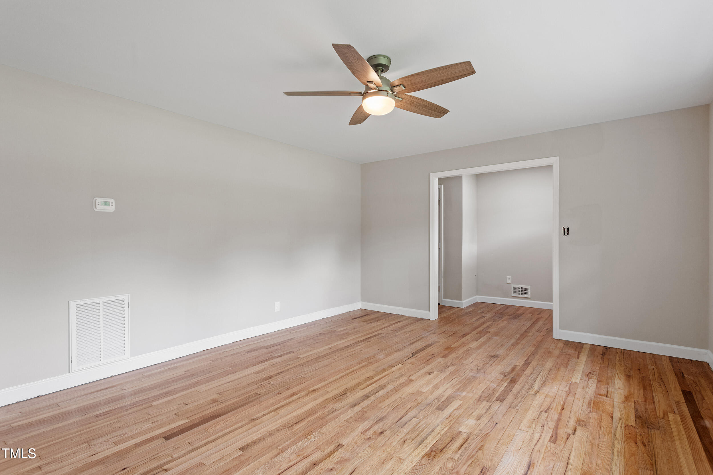3325 Old Buffalo Road Raleigh, NC 27604 - Photo 4 of 26 a view of an empty room and wooden floor