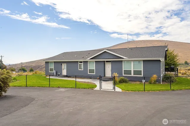 a front view of a house with swimming pool and porch