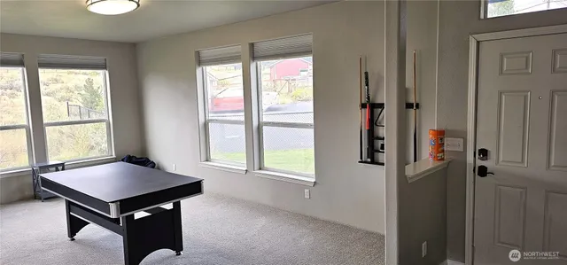 a view of a livingroom with furniture and window