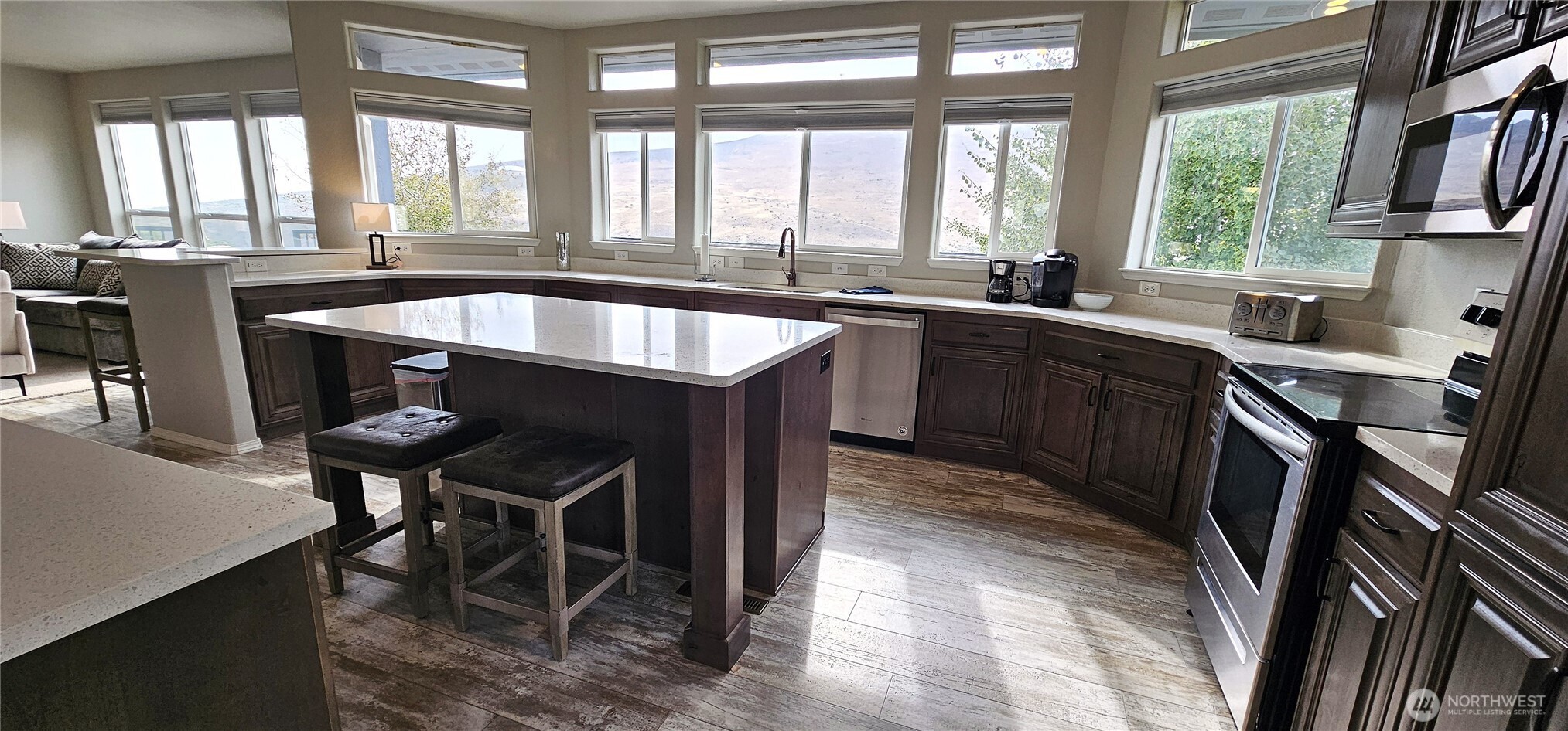 435 Maringo Road Ephrata, WA 98823 - Photo 15 of 40 a kitchen with a table chairs sink and cabinets
