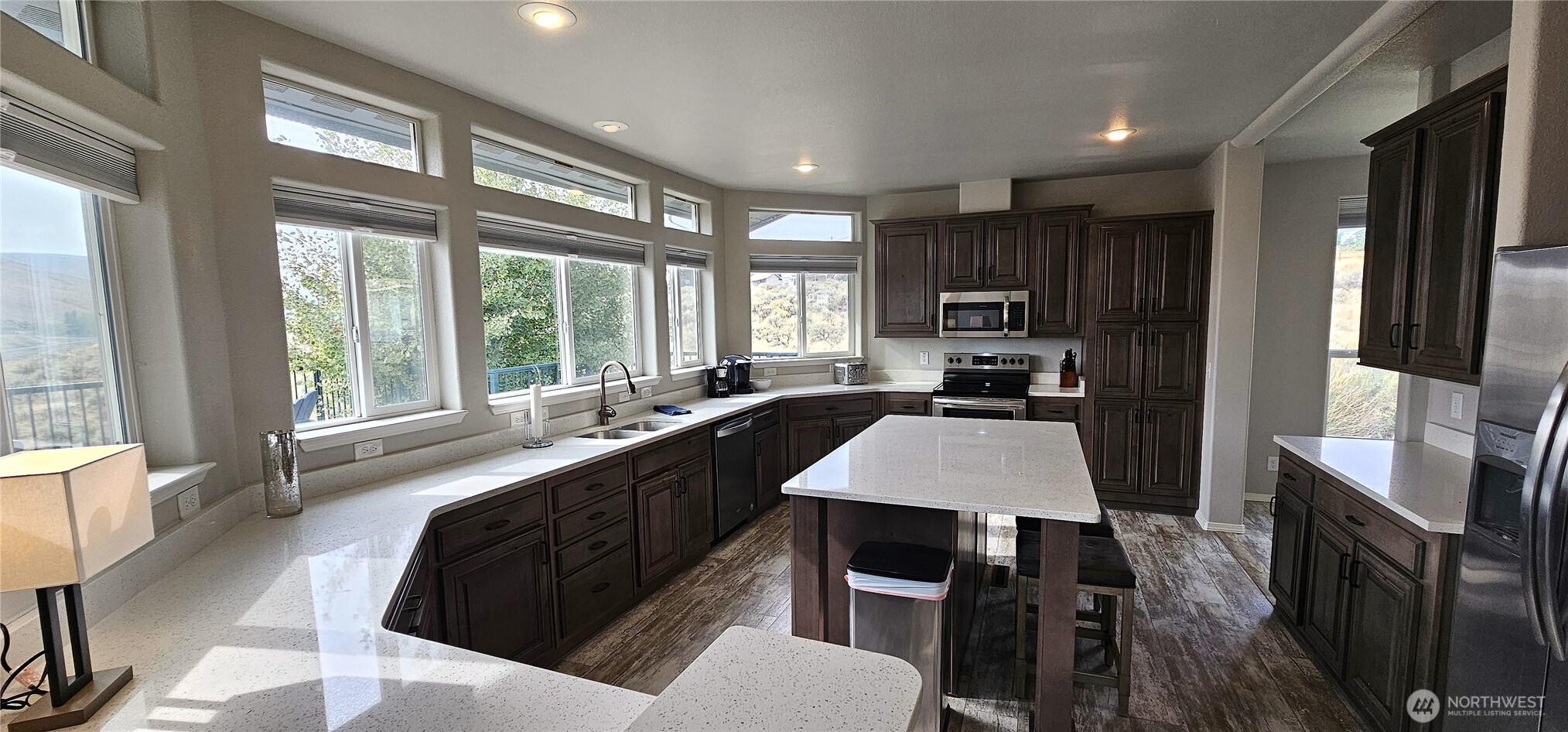 435 Maringo Road Ephrata, WA 98823 - Photo 18 of 40 a large kitchen with sink a refrigerator and wooden floor