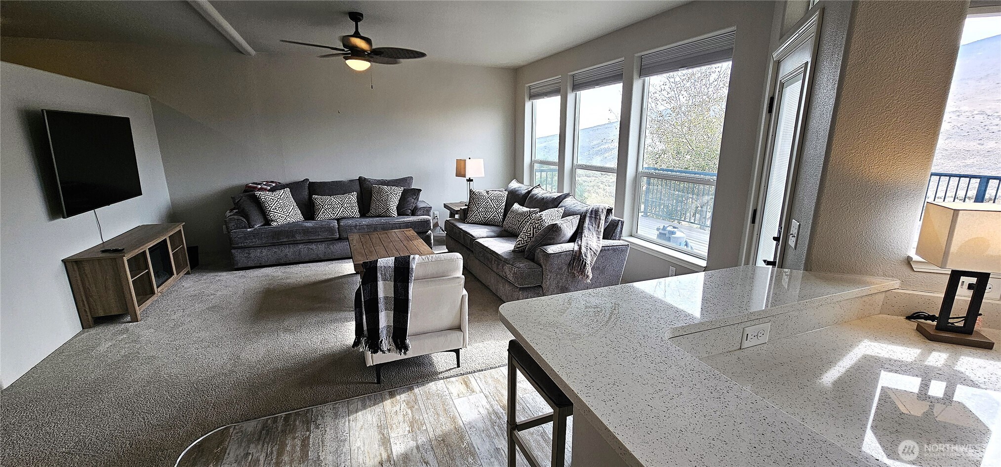 435 Maringo Road Ephrata, WA 98823 - Photo 19 of 40 a living room with fireplace furniture and a flat screen tv
