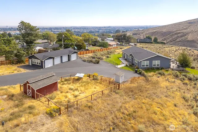 an aerial view of residential houses with outdoor space