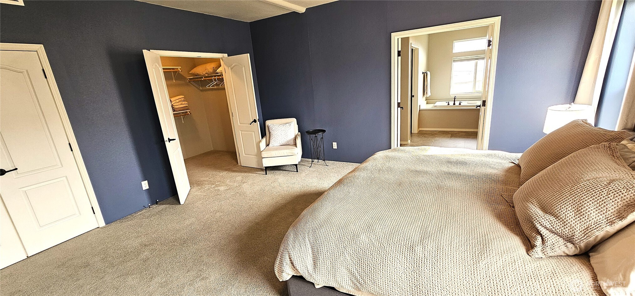 435 Maringo Road Ephrata, WA 98823 - Photo 24 of 40 a bedroom with a bed and a mirror