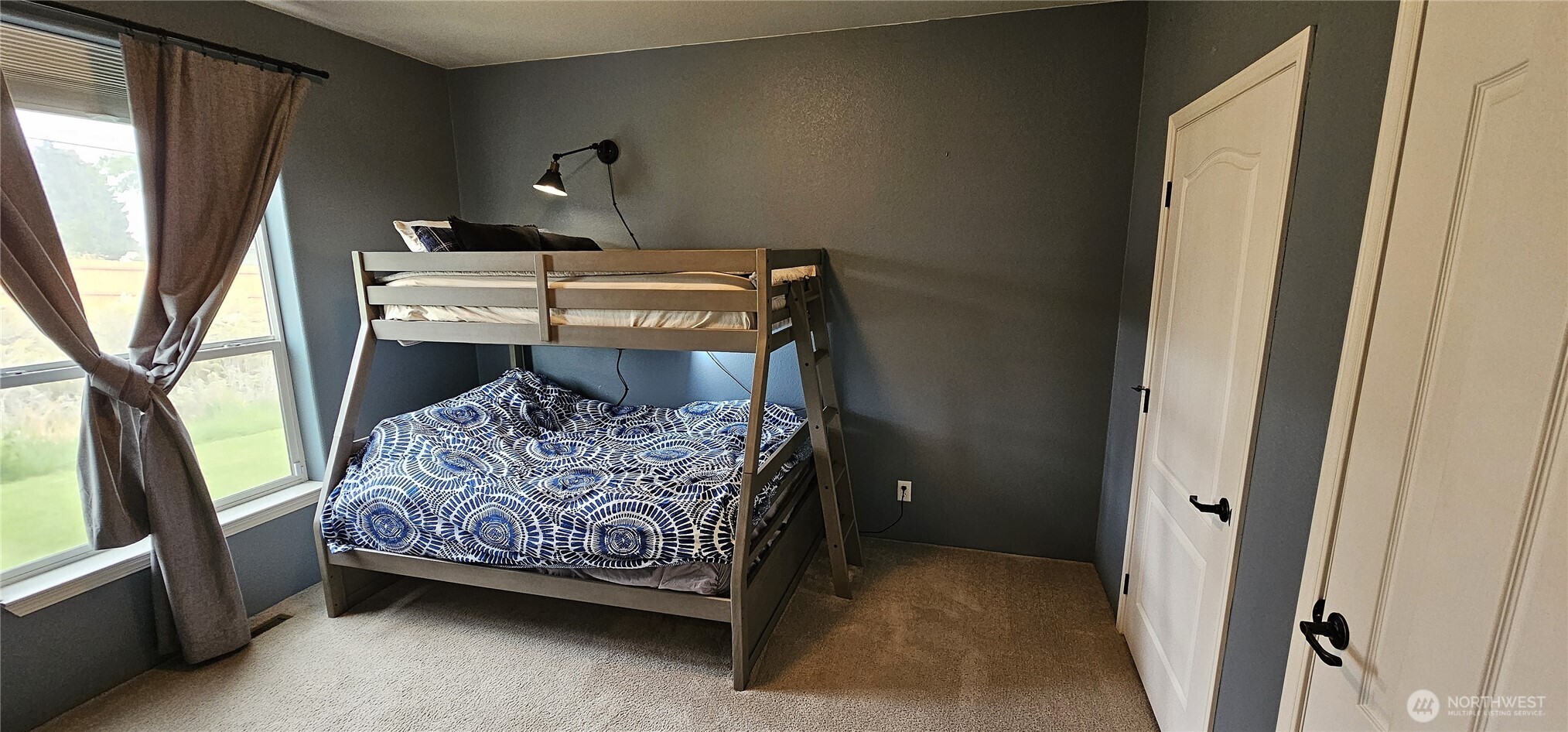 435 Maringo Road Ephrata, WA 98823 - Photo 28 of 40 a bed sitting in a bedroom next to a window