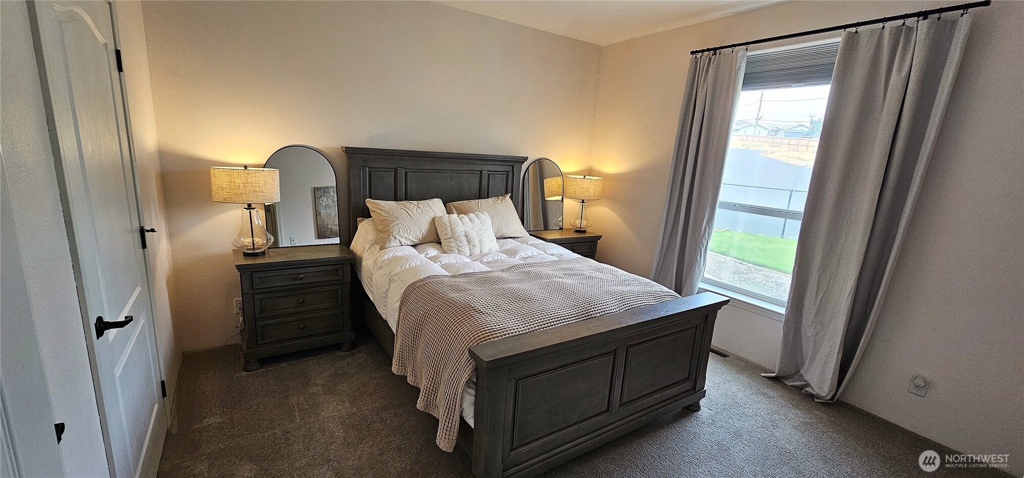 435 Maringo Road Ephrata, WA 98823 - Photo 29 of 40 a bed sitting in a bedroom next to a window