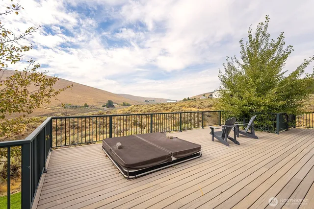 a view of a terrace with wooden floor and seating space