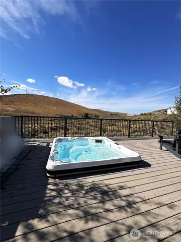 a view of a swimming pool with furniture