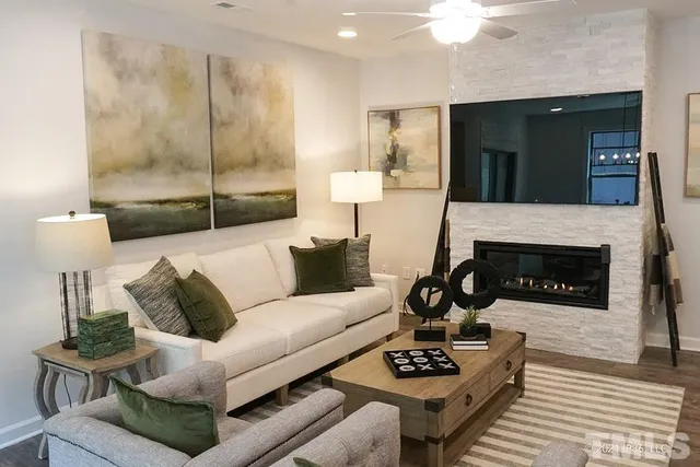 a living room with furniture and a fireplace