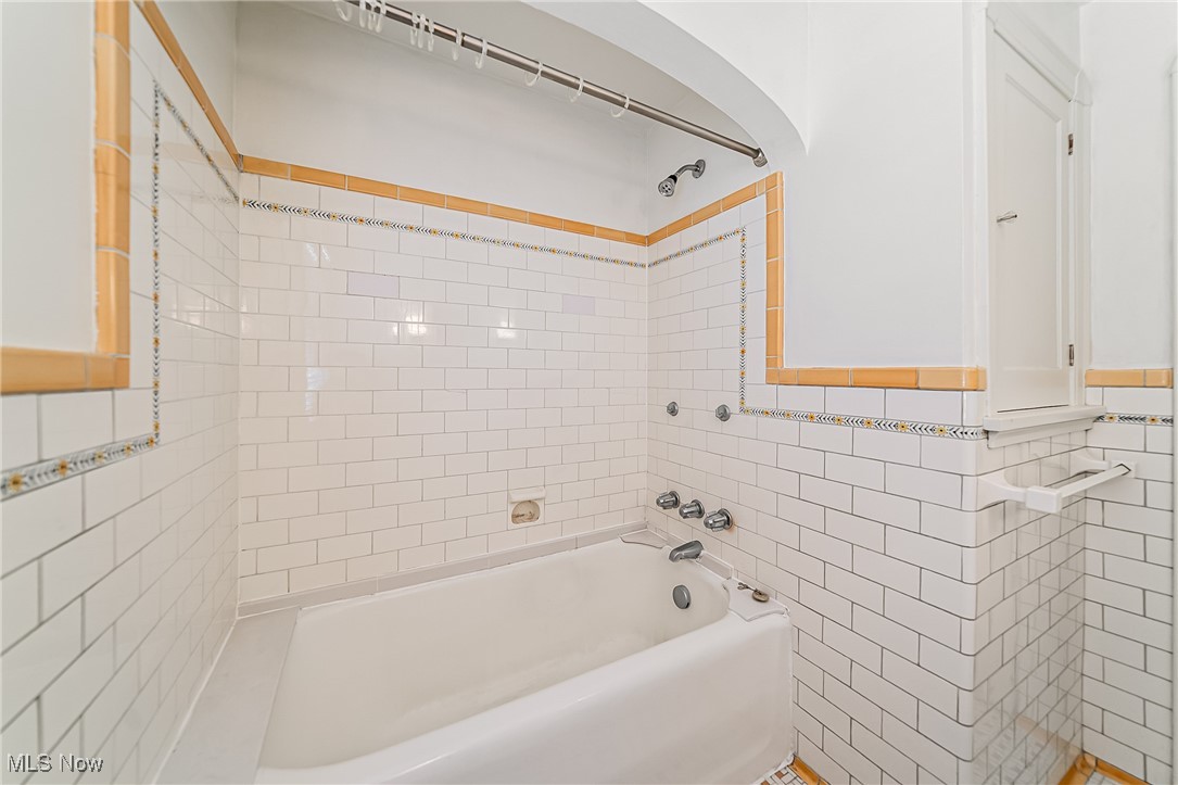 6711 Forest Avenue Parma, OH 44129 - Photo 26 of 33 Full bathroom featuring tile walls and bathing tub / shower combination