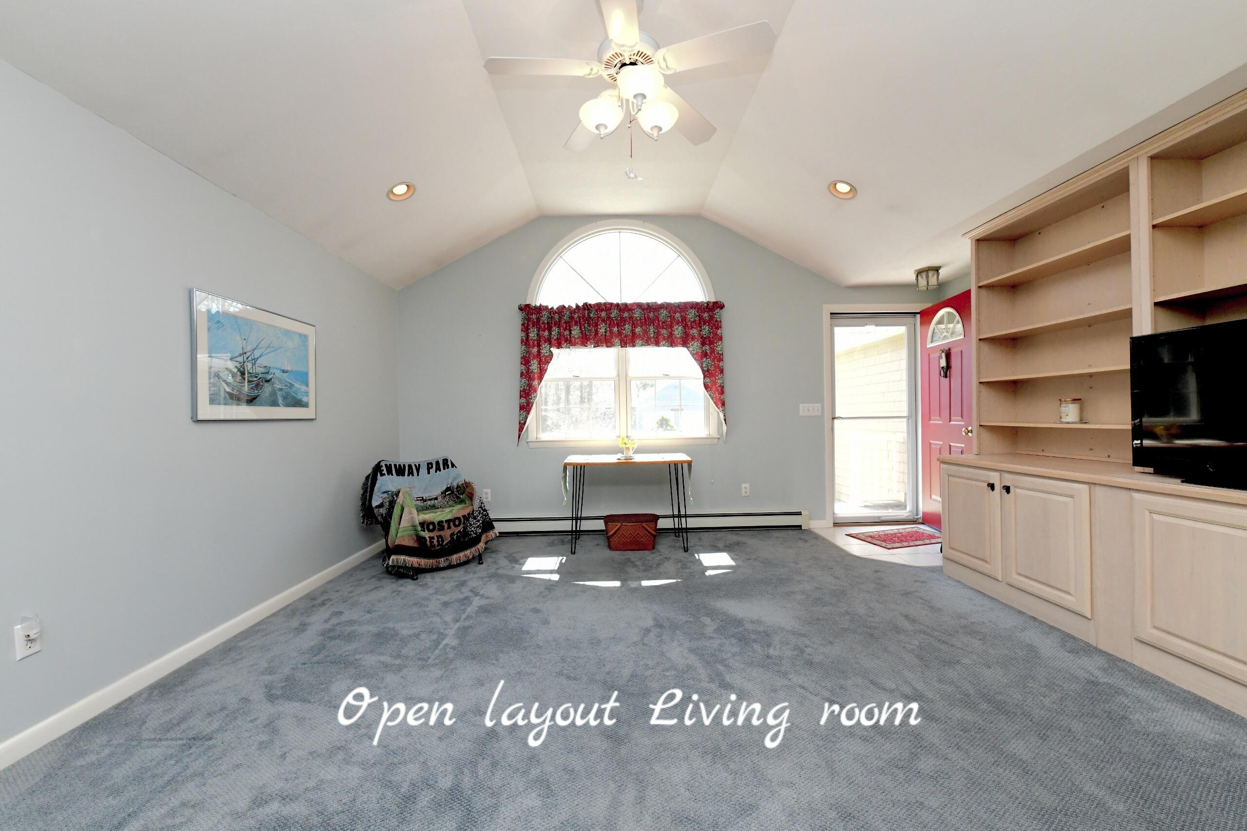 25 Andrew Road Sagamore Beach, MA 02562 - Photo 12 of 45 a living room with furniture and a flat screen tv
