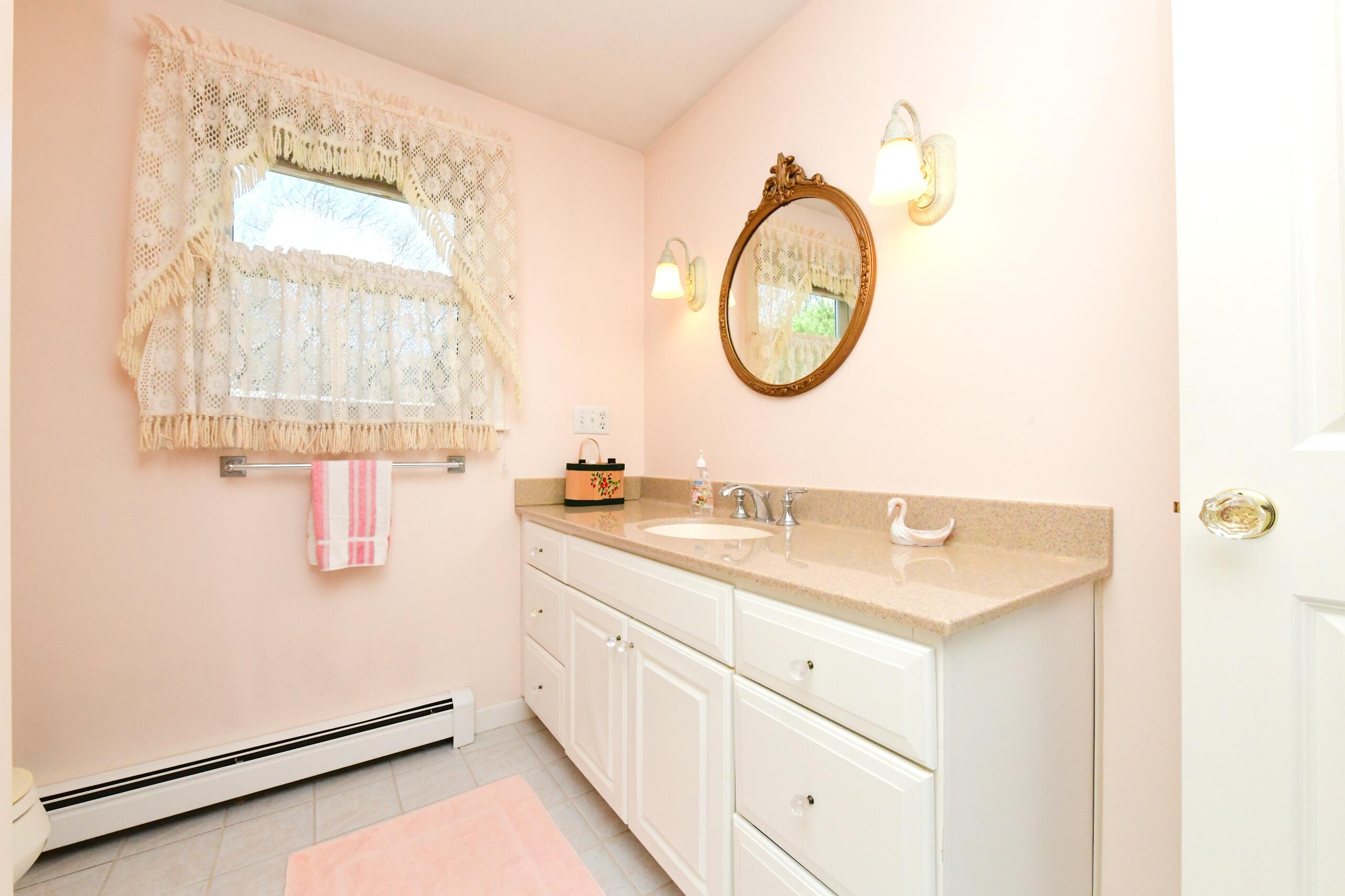 25 Andrew Road Sagamore Beach, MA 02562 - Photo 20 of 45 a bathroom with a sink and a mirror