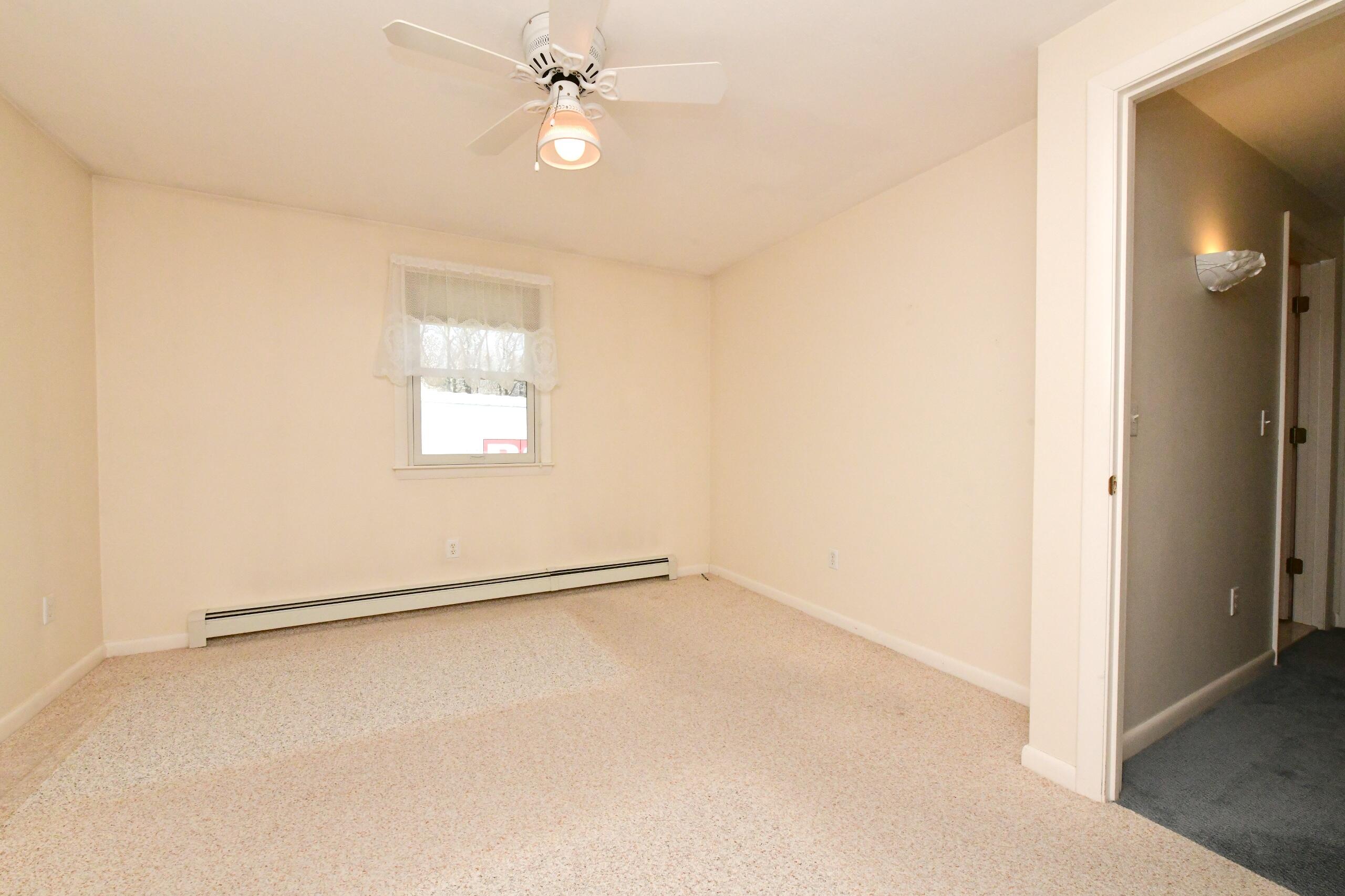 25 Andrew Road Sagamore Beach, MA 02562 - Photo 22 of 45 an empty room with windows and fan