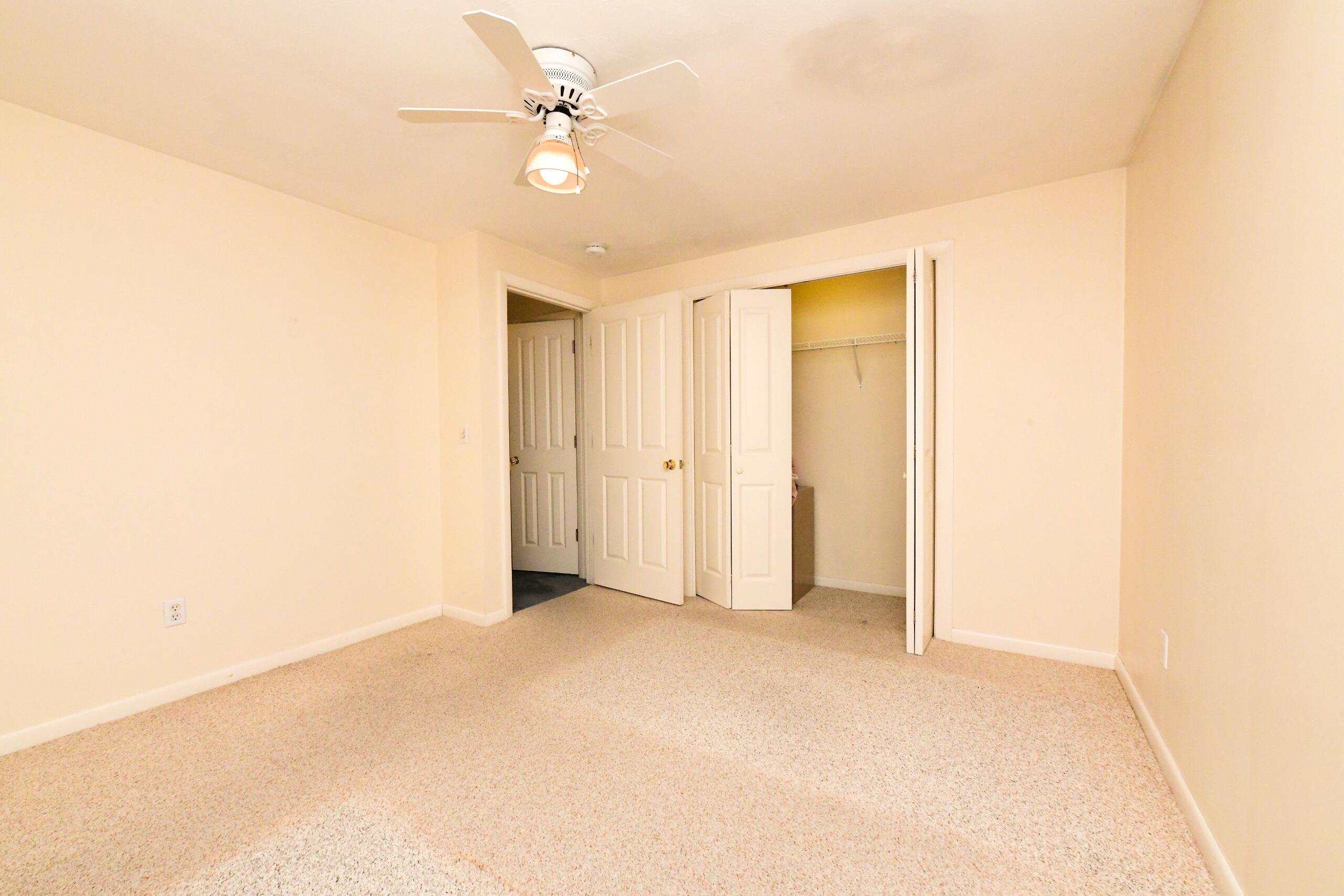 25 Andrew Road Sagamore Beach, MA 02562 - Photo 23 of 45 an empty room with a ceiling fan
