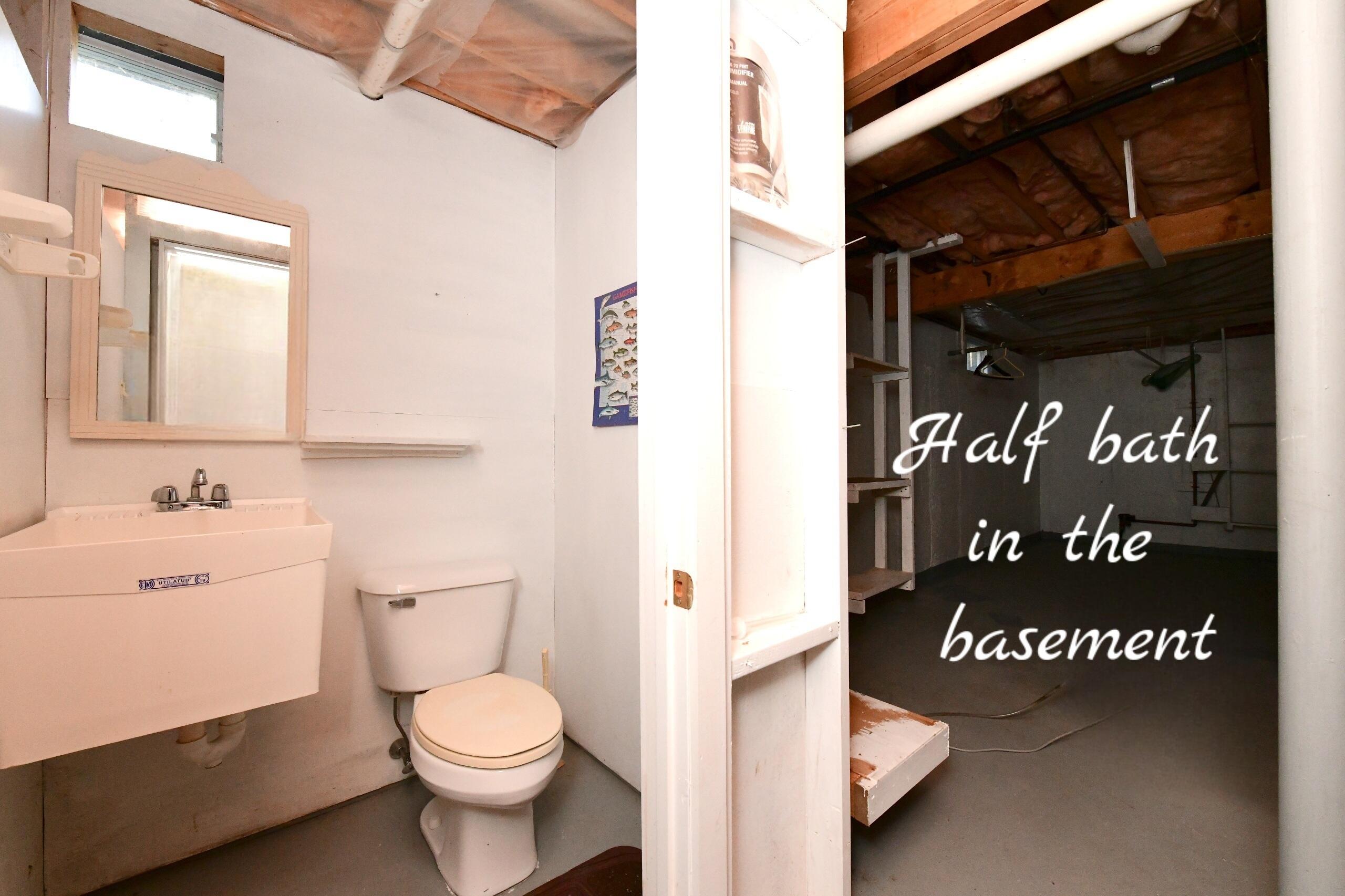 25 Andrew Road Sagamore Beach, MA 02562 - Photo 26 of 45 a bathroom with a toilet a sink and a large mirror