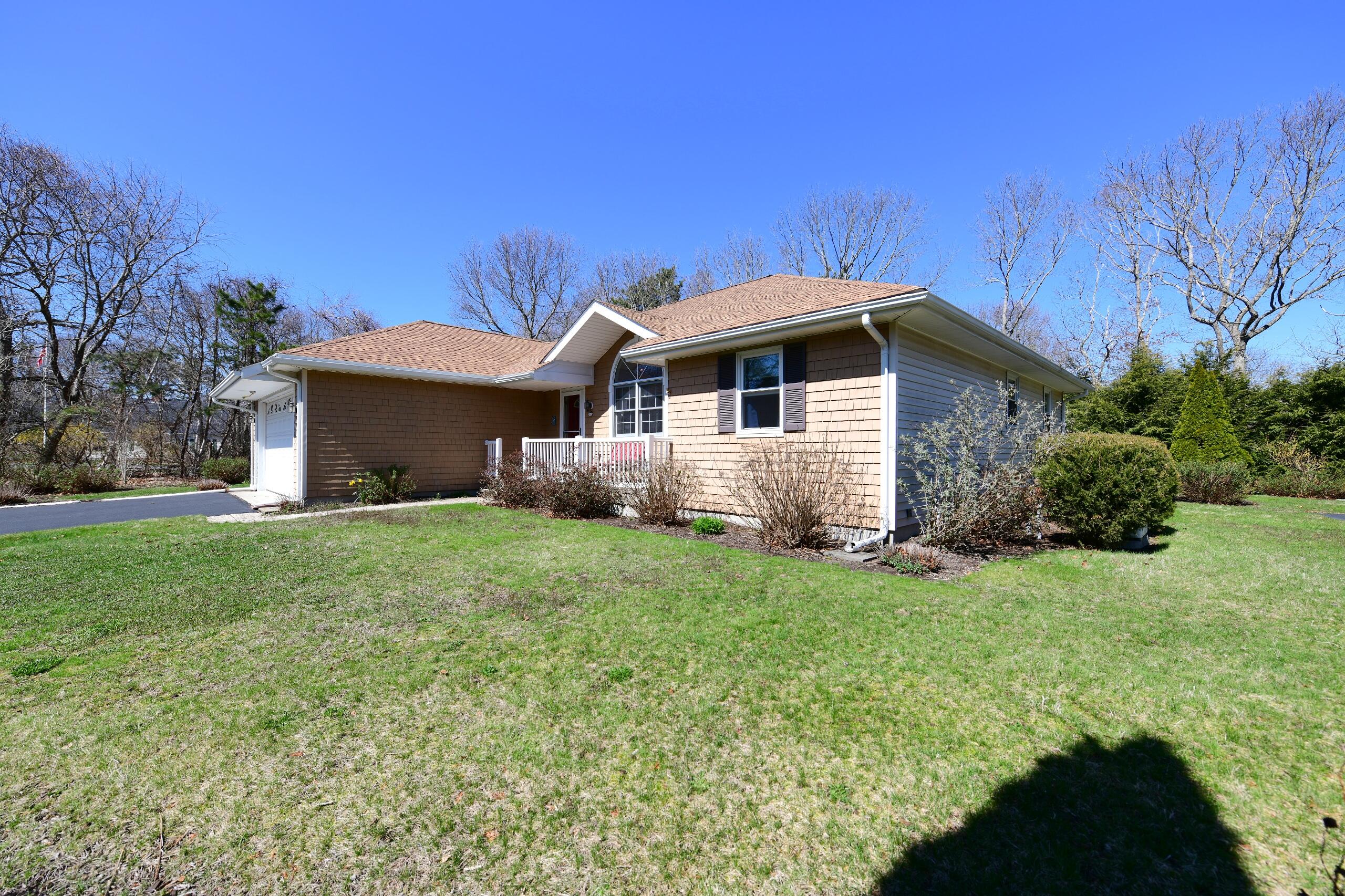 25 Andrew Road Sagamore Beach, MA 02562 - Photo 31 of 45 a front view of a house with a garden