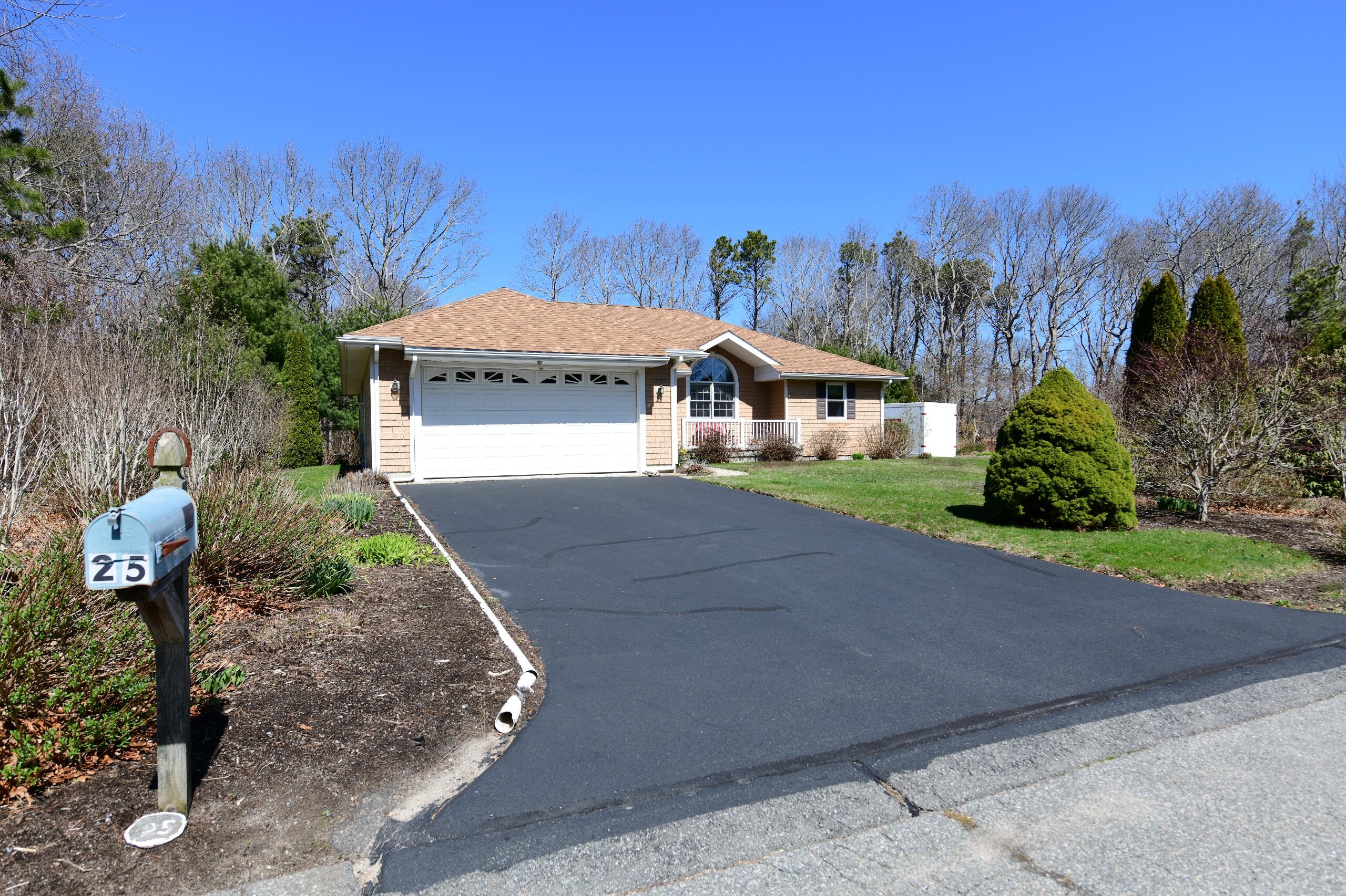 25 Andrew Road Sagamore Beach, MA 02562 - Photo 33 of 45 a front view of a house with a yard and mountain view in back