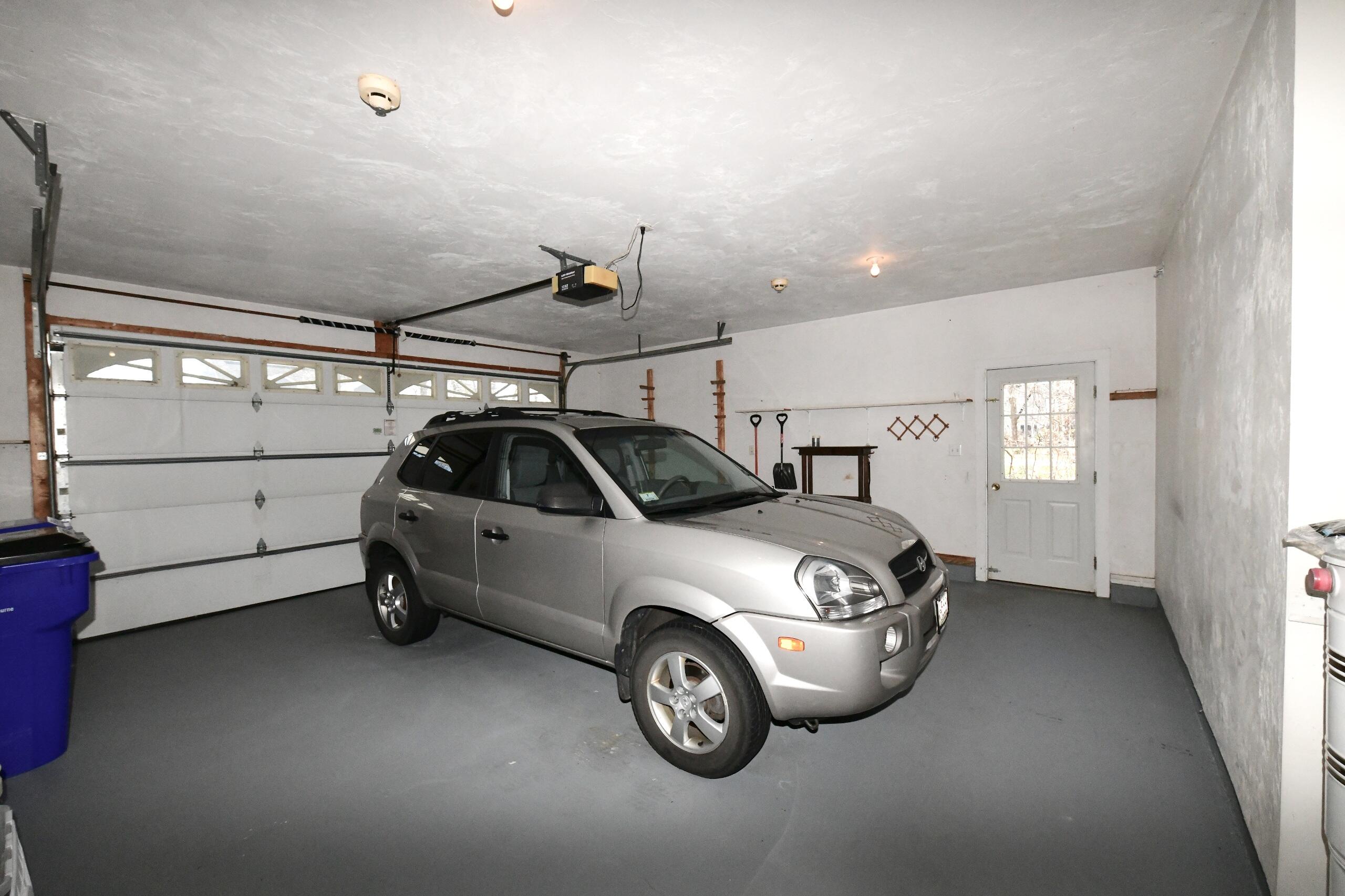 25 Andrew Road Sagamore Beach, MA 02562 - Photo 34 of 45 a car parked in a garage