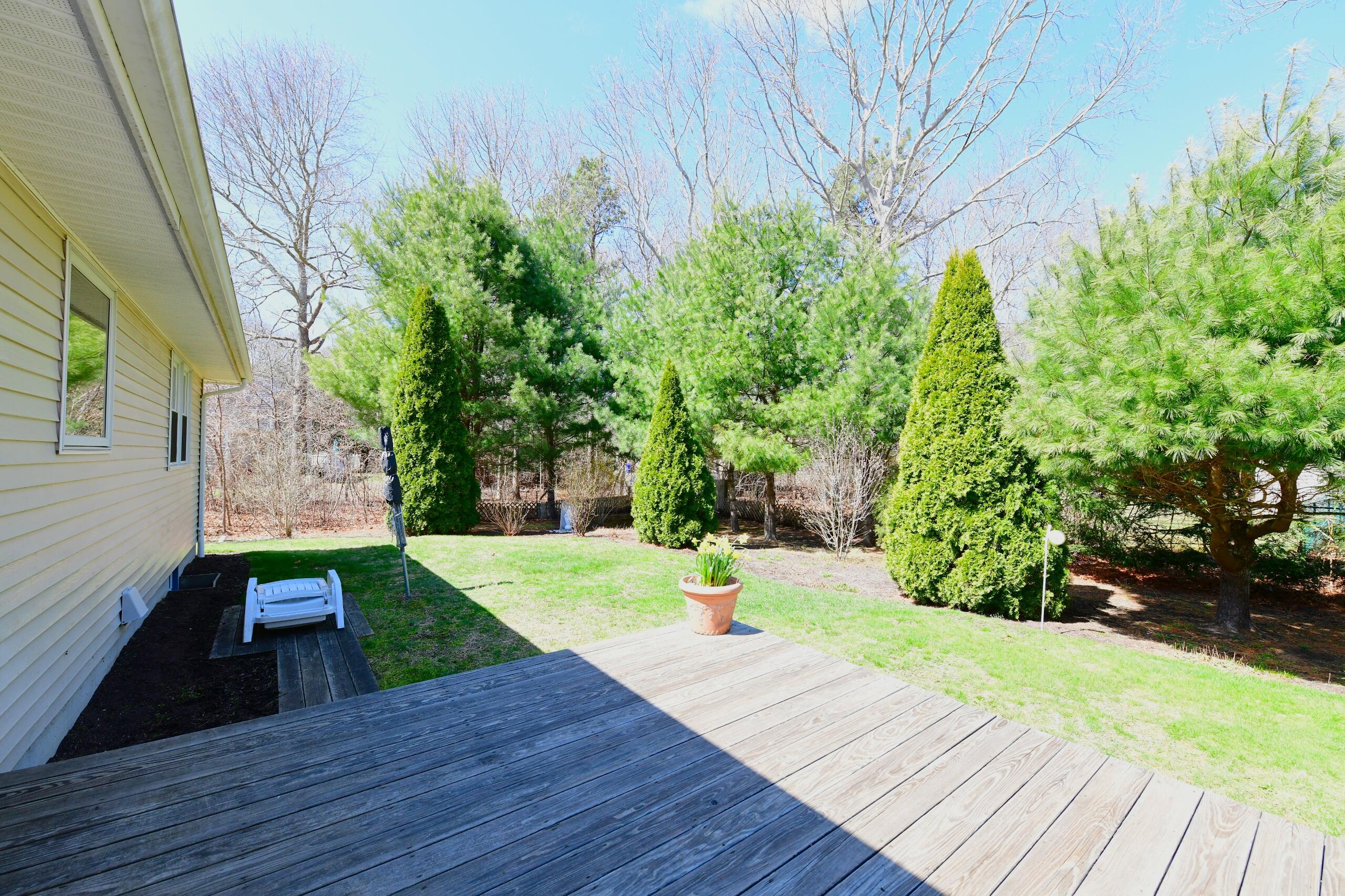 25 Andrew Road Sagamore Beach, MA 02562 - Photo 35 of 45 a view of a backyard of the house
