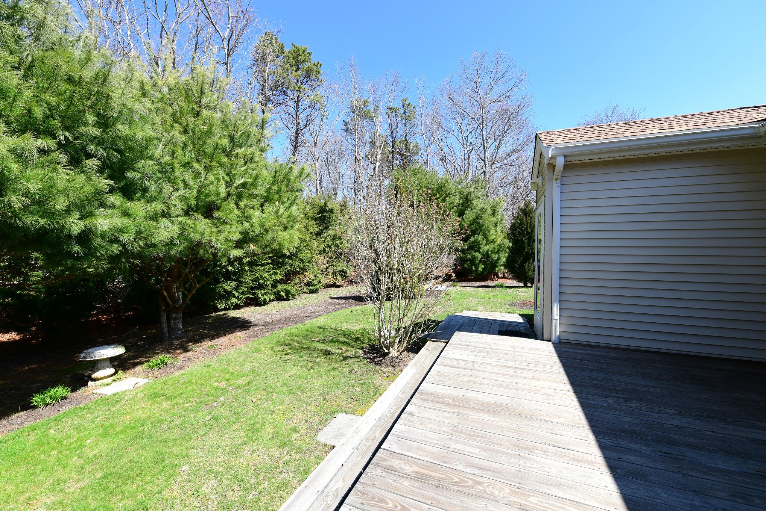 25 Andrew Road Sagamore Beach, MA 02562 - Photo 36 of 45 a view of a backyard with potted plants