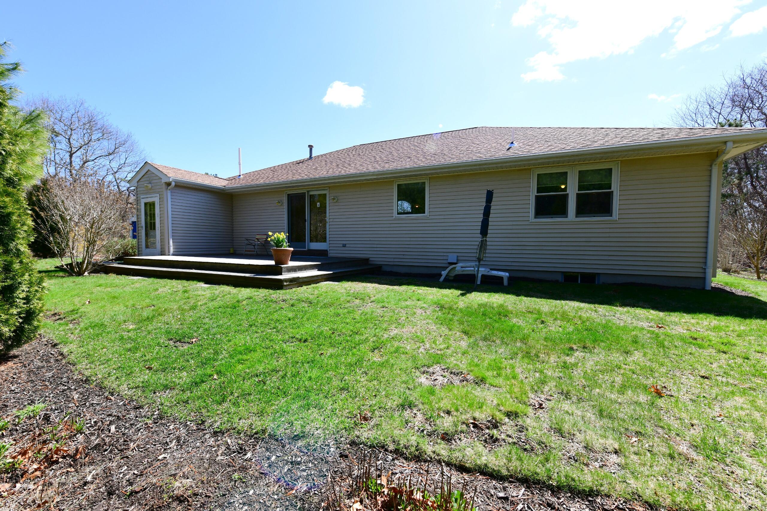 25 Andrew Road Sagamore Beach, MA 02562 - Photo 37 of 45 a front view of a house with garden