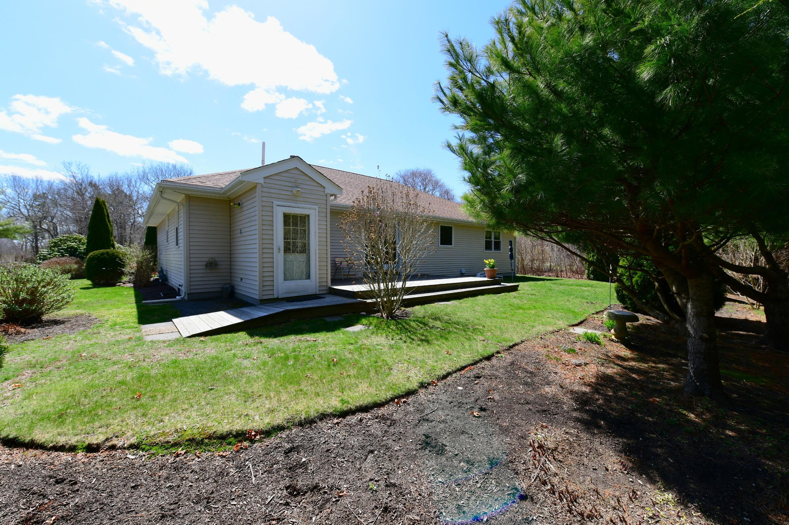 25 Andrew Road Sagamore Beach, MA 02562 - Photo 38 of 45 a front view of a house with garden